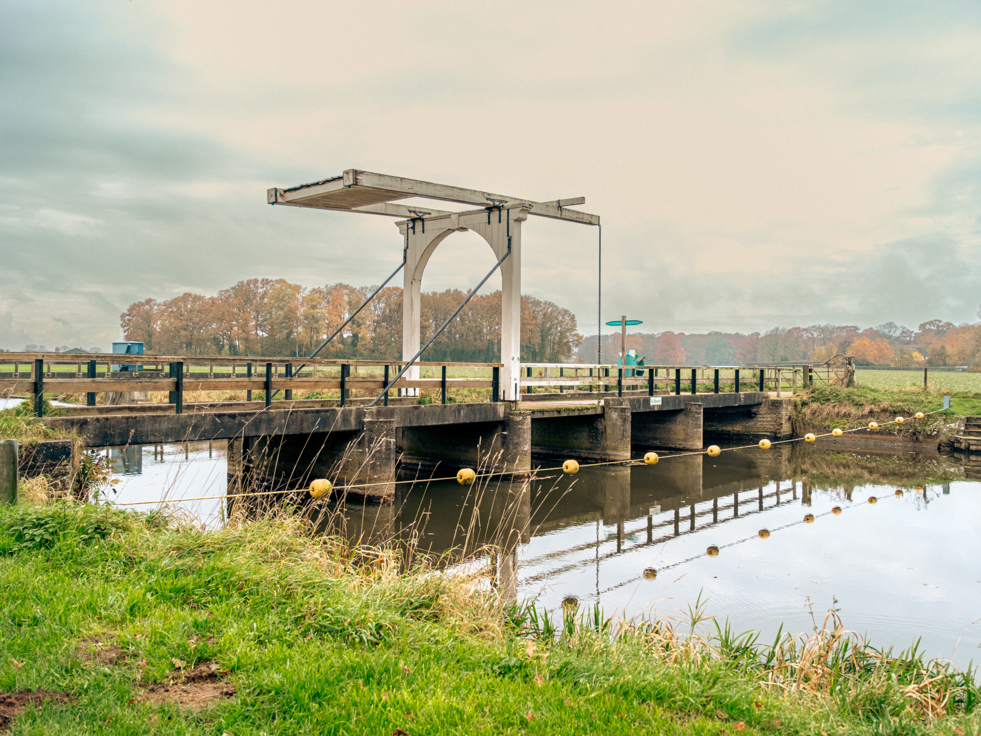 Rustic Drawbridge over Tranquil Canal