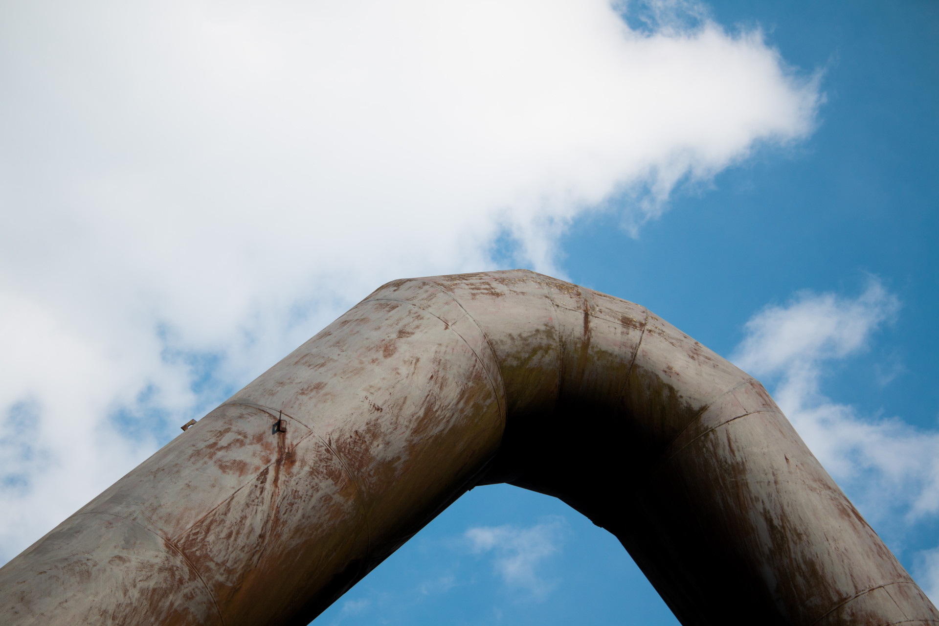 Rustic Pipe Against Blue Sky