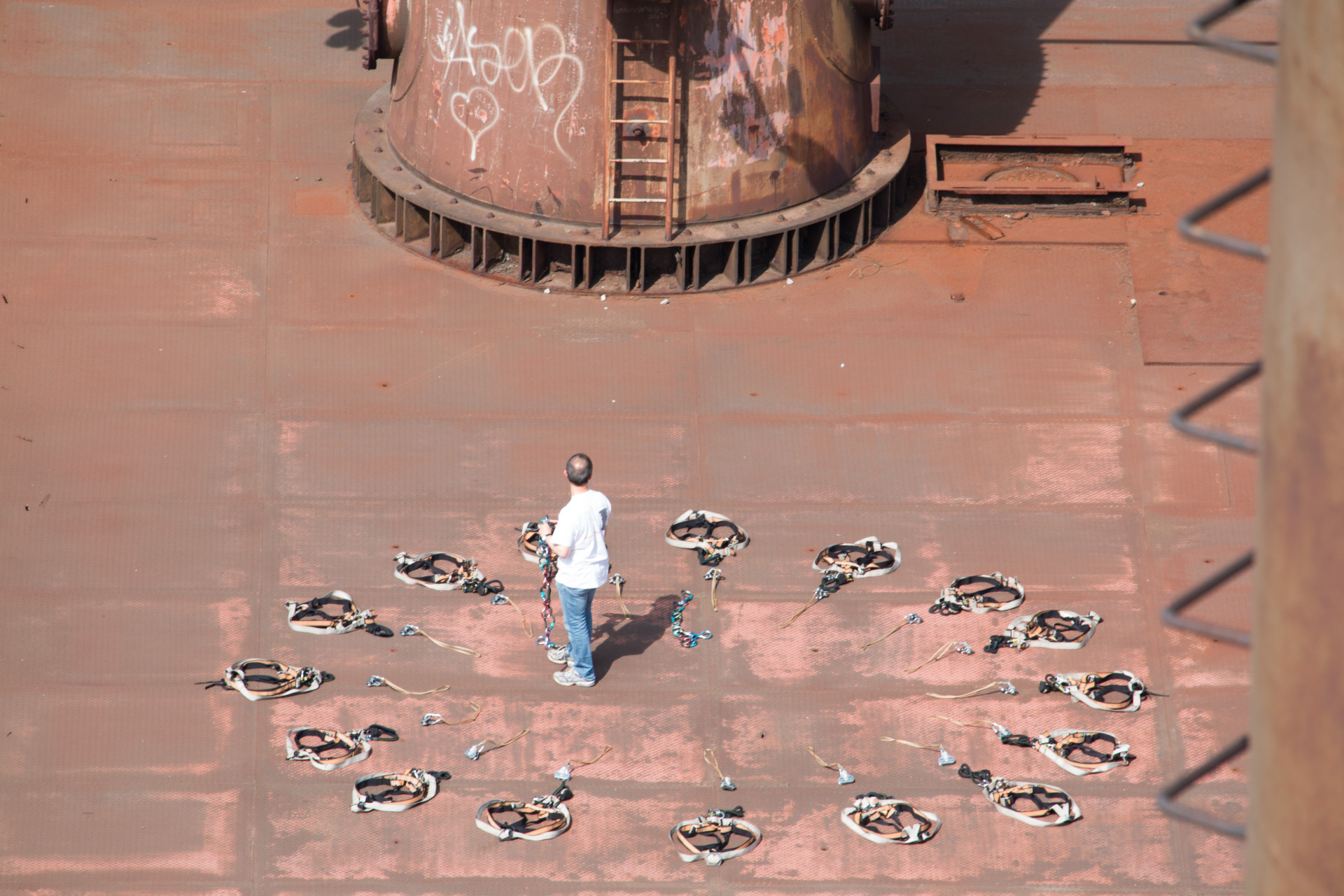 Man on Industrial Deck Observing Equipment