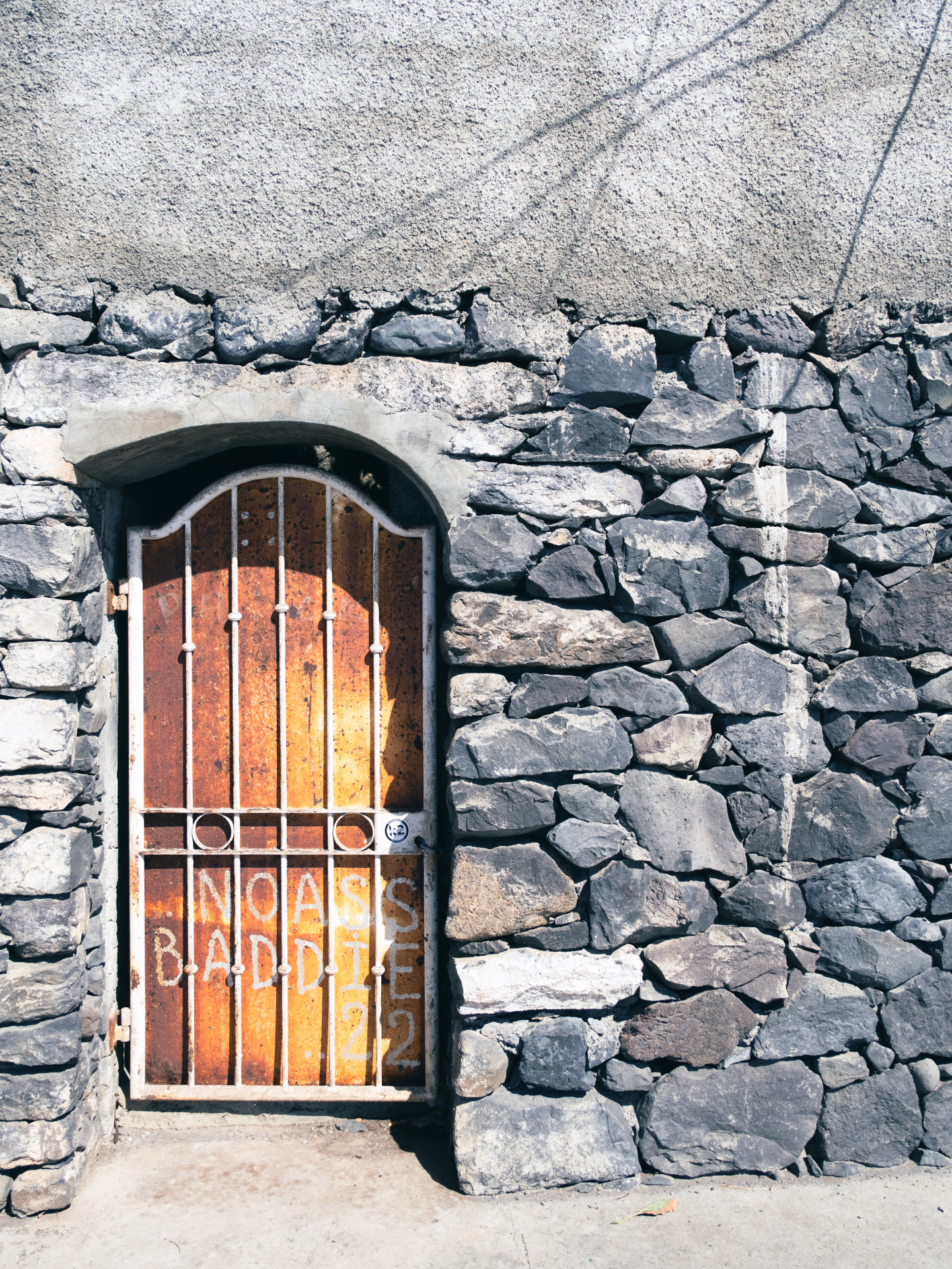 Rusted Gate with Graffiti in Basalt Wall, Funchal