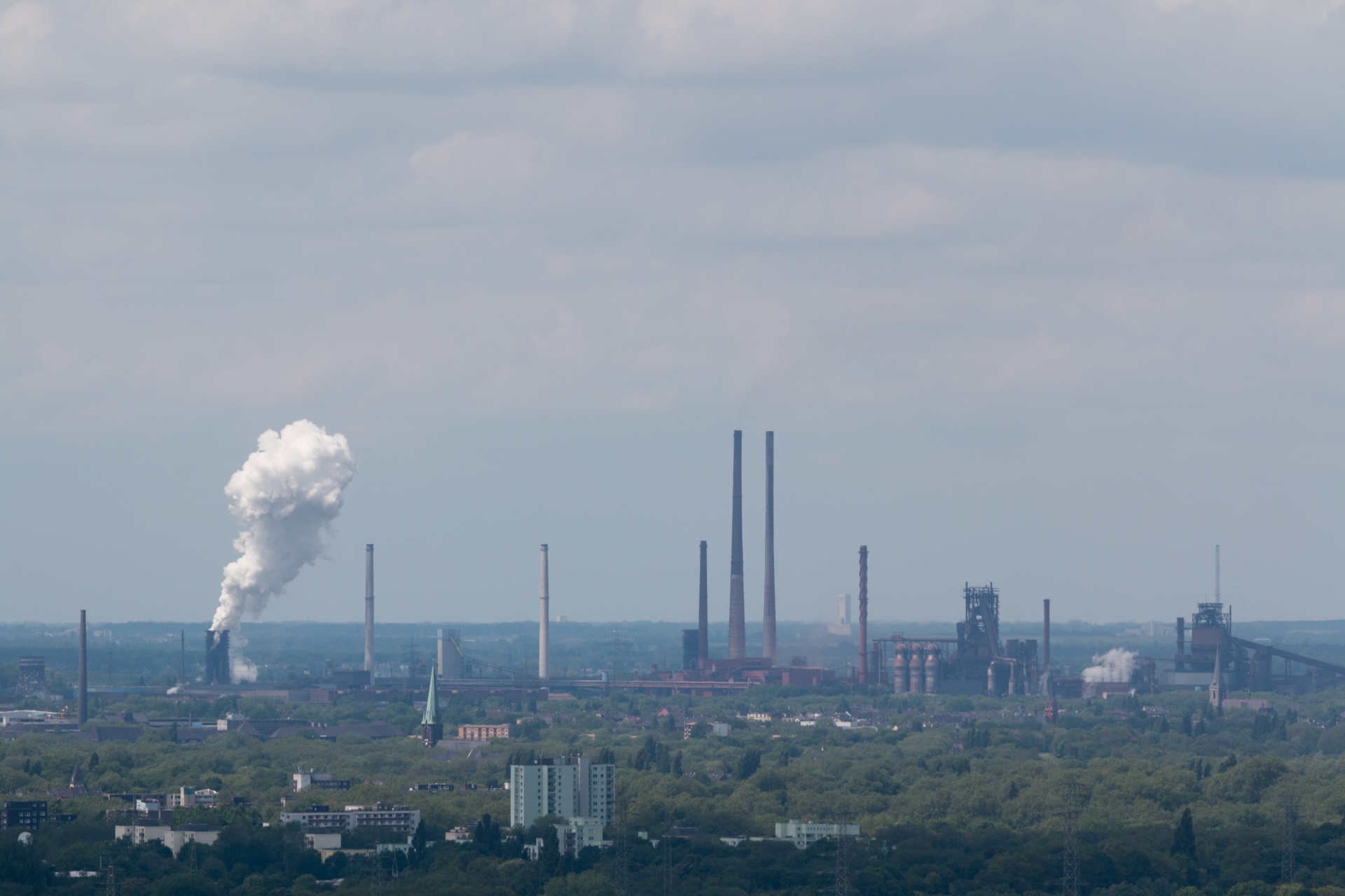 Industrial Skyline with Emissions