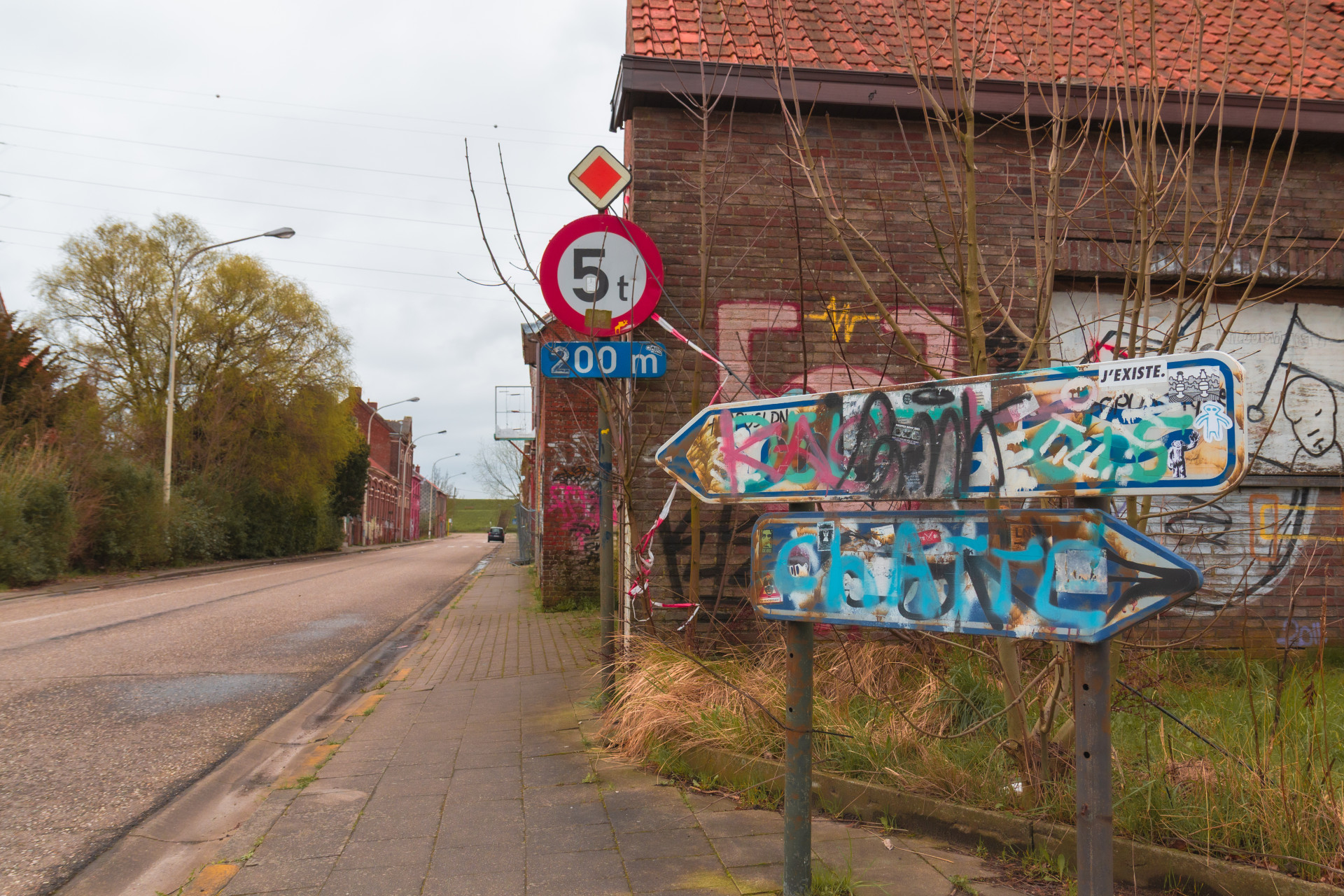 Graffiti-Covered Sign in Doel