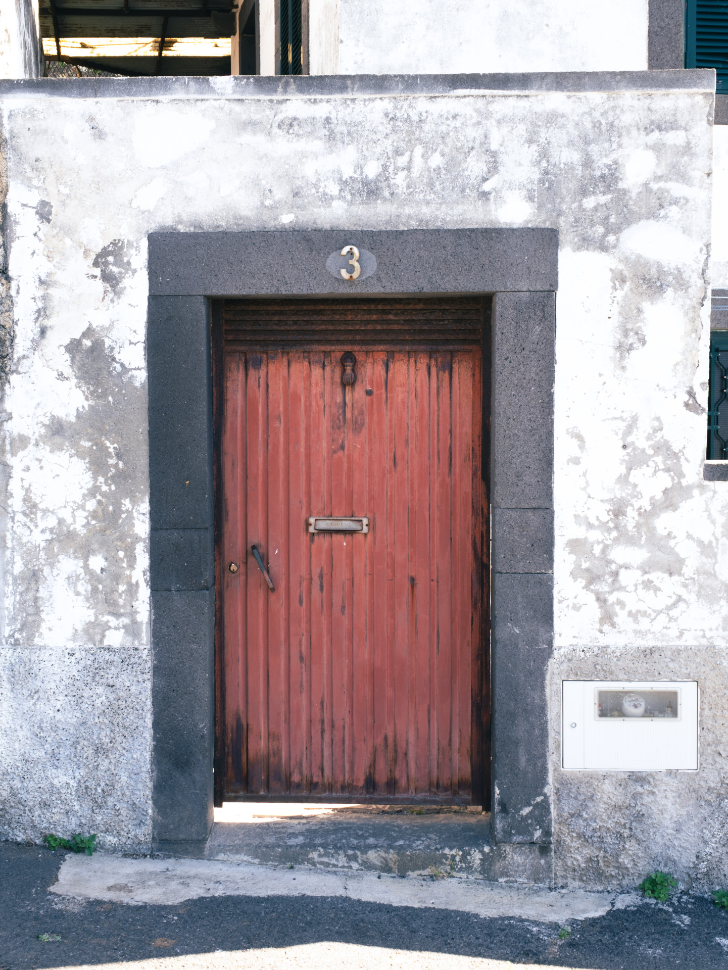 Weathered Red Door with Basalt Frame, Funchal
