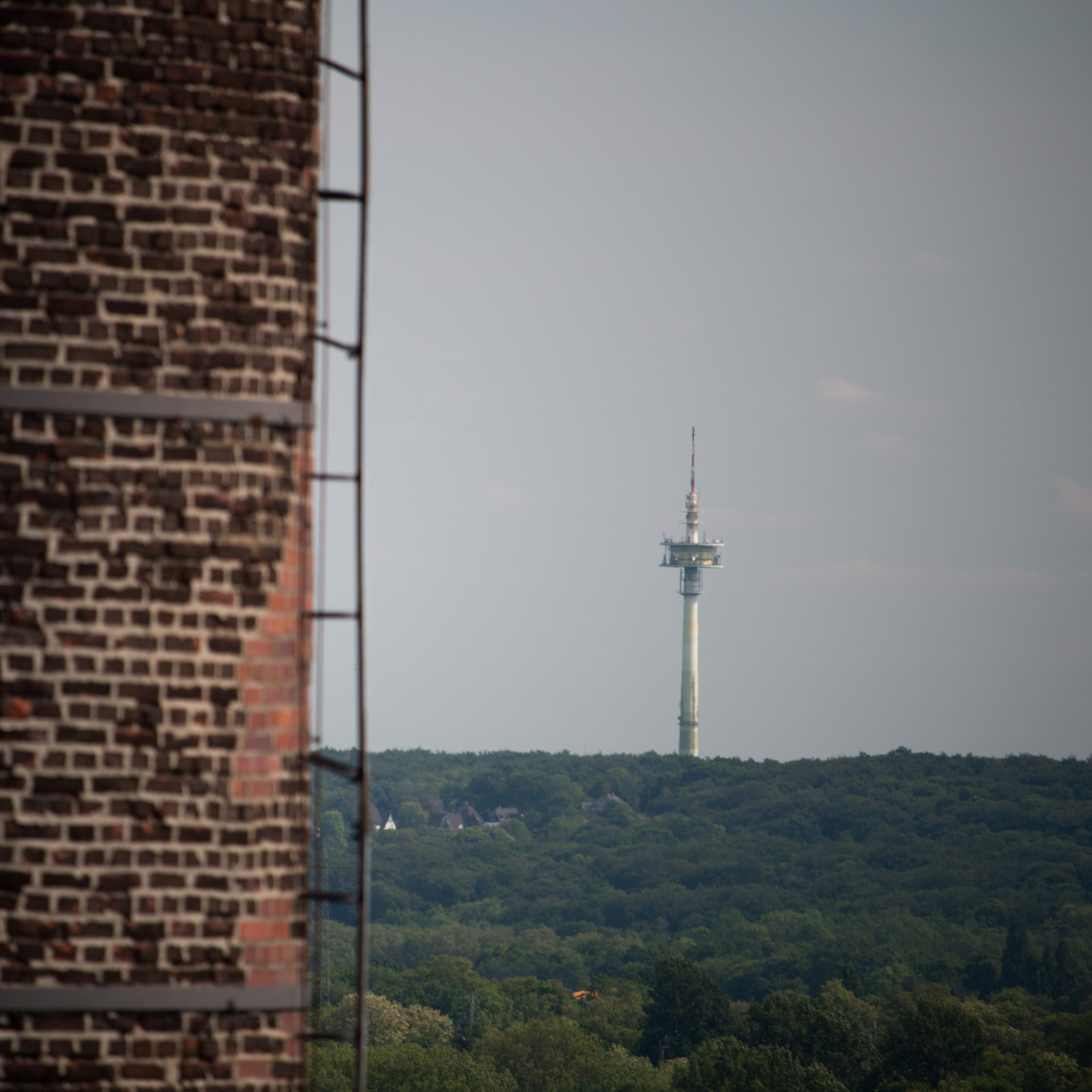 Television Tower Behind Brick Wall