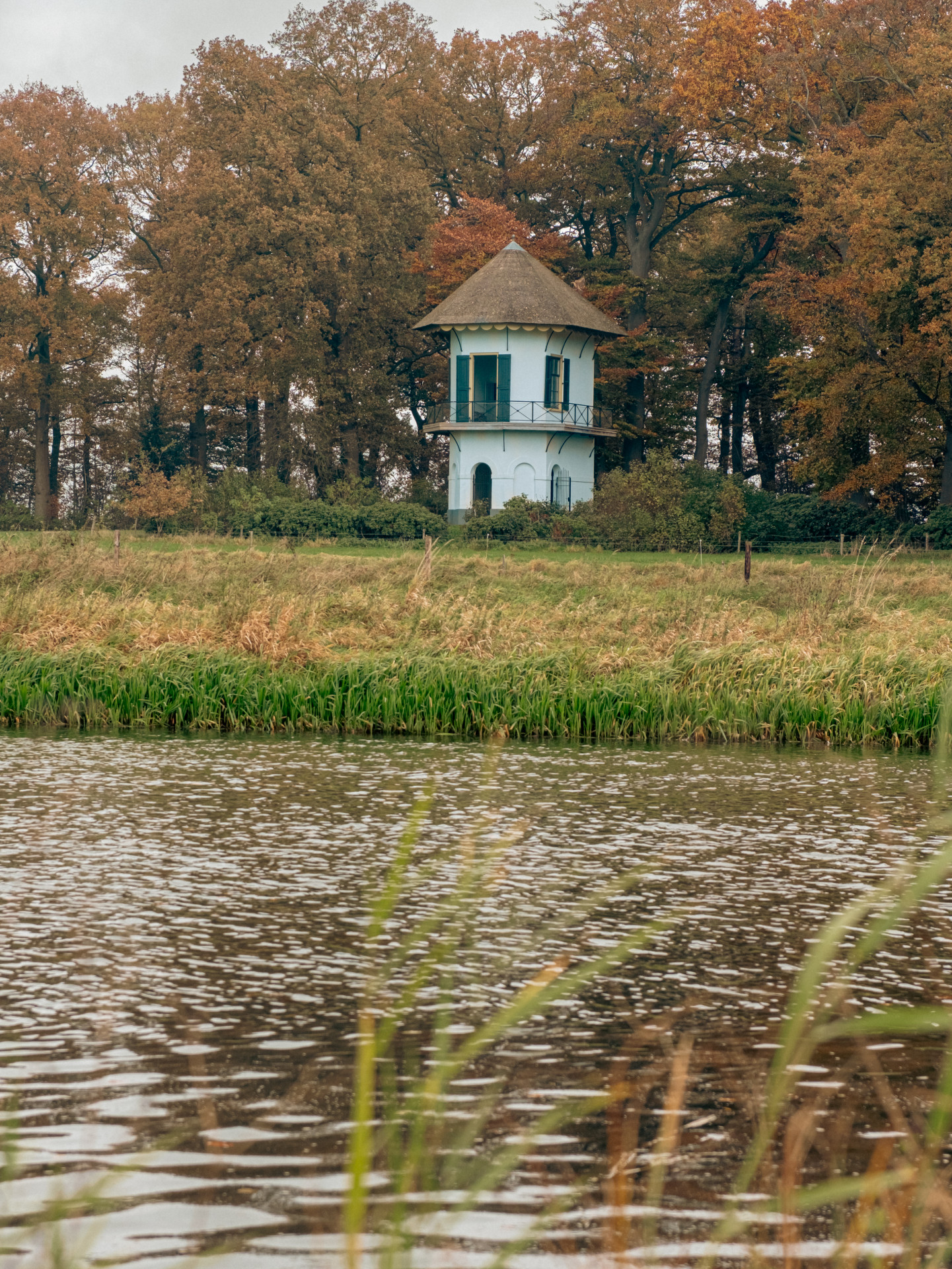 Charming Tower by Autumn Lake
