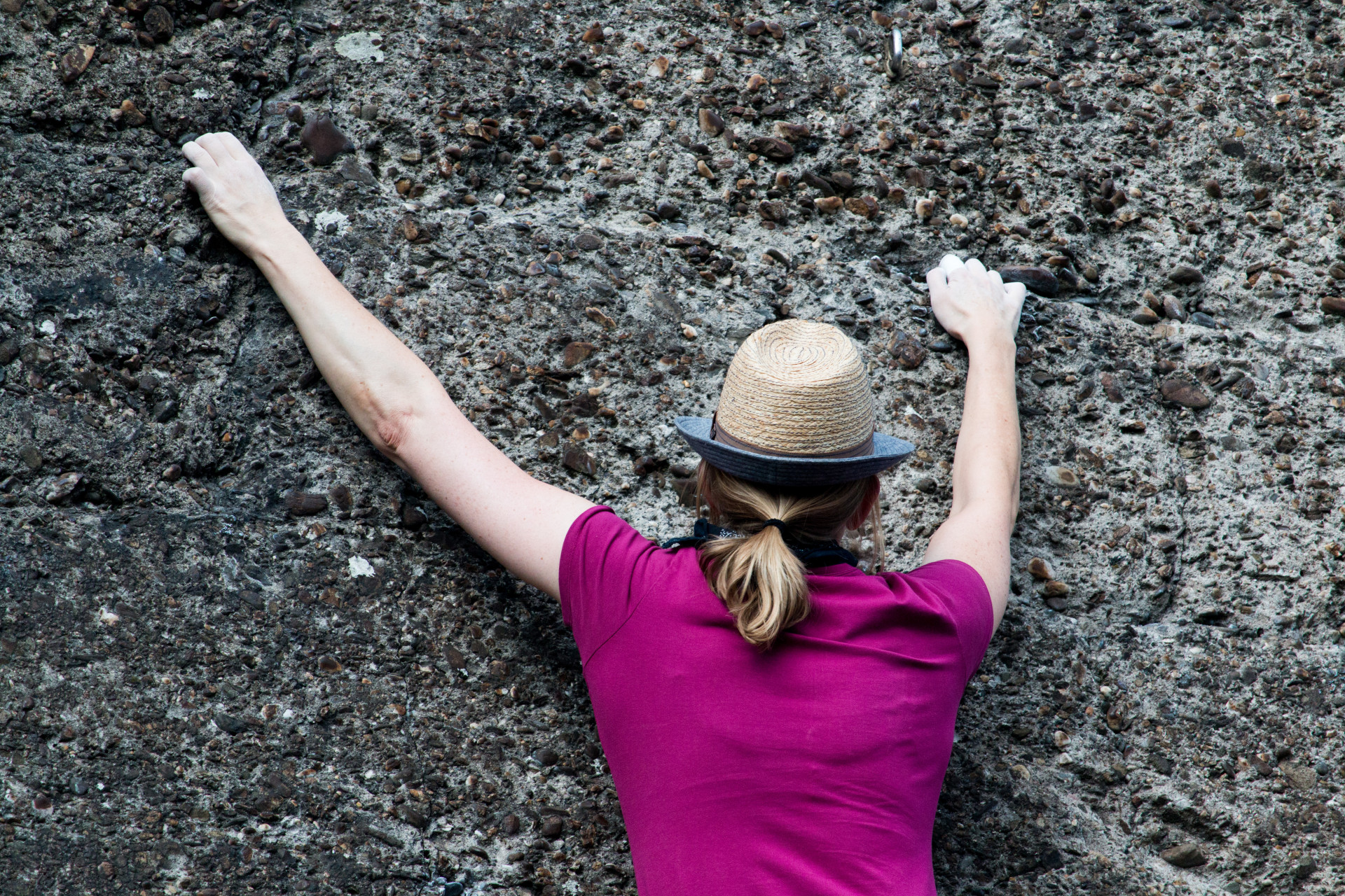 Climber's Ascent on Rocky Surface